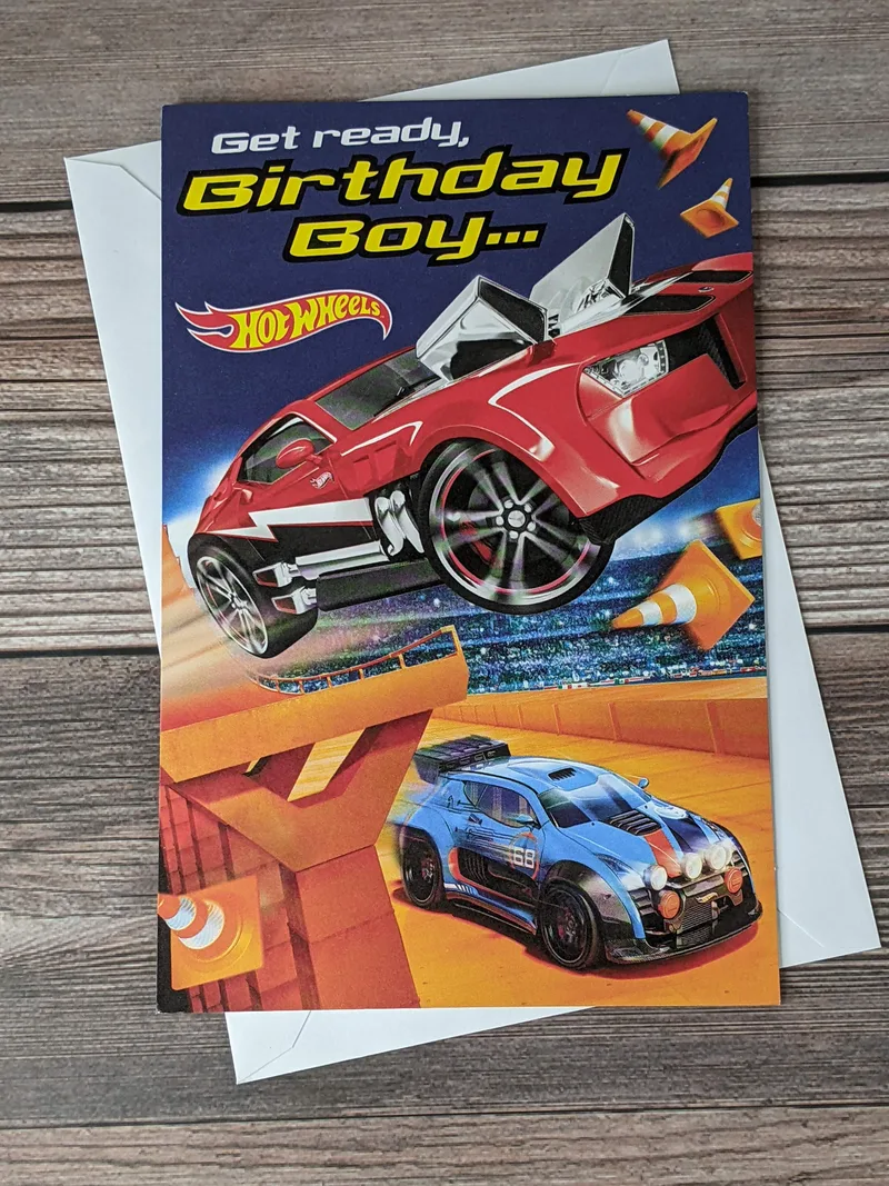 A birthday card for a boy with an image of Hot Wheels racing cars on the cover.